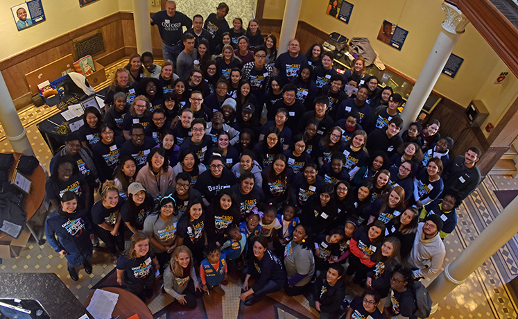 Students gather in the Oxford student center to pack boxes for Emory Cares.